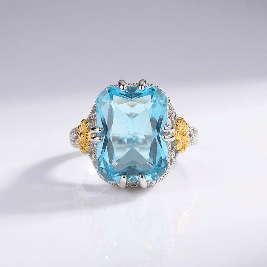 Anillo vintage con aguamarina dorada de Rose & Oliver, detalle elegante y piedra azul en plata envejecida.