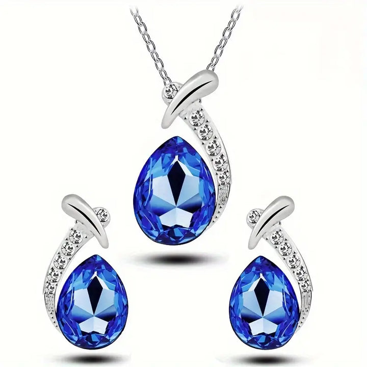 Conjunto de joyas Elegancia de Sirena Clásico en oro blanco, incluyendo collar y aretes, de la marca Rose & Oliver.