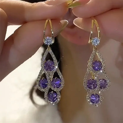Pendientes de cristal morado en gota de la marca Rose & Oliver, elegantes accesorios de pendientes de plata con detalles brillantes.